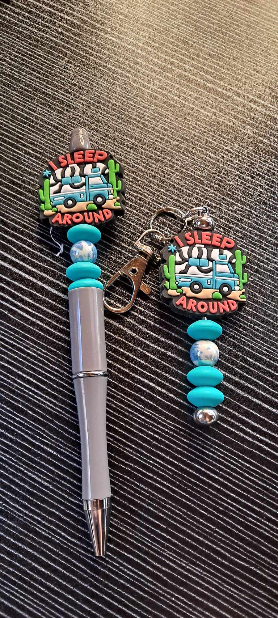 I sleep around VW focal blue swirl pen and keychain set