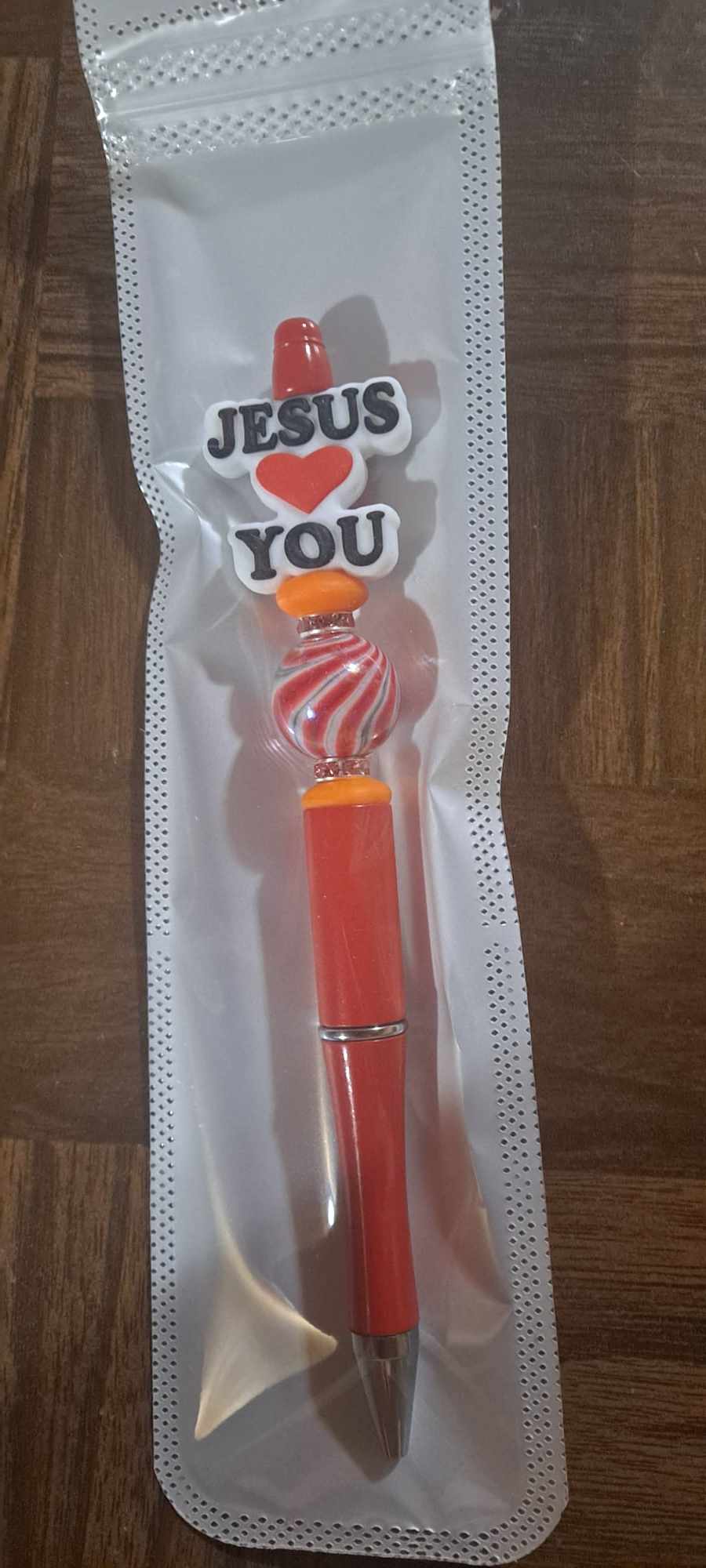 Jesus loves you focal red pen