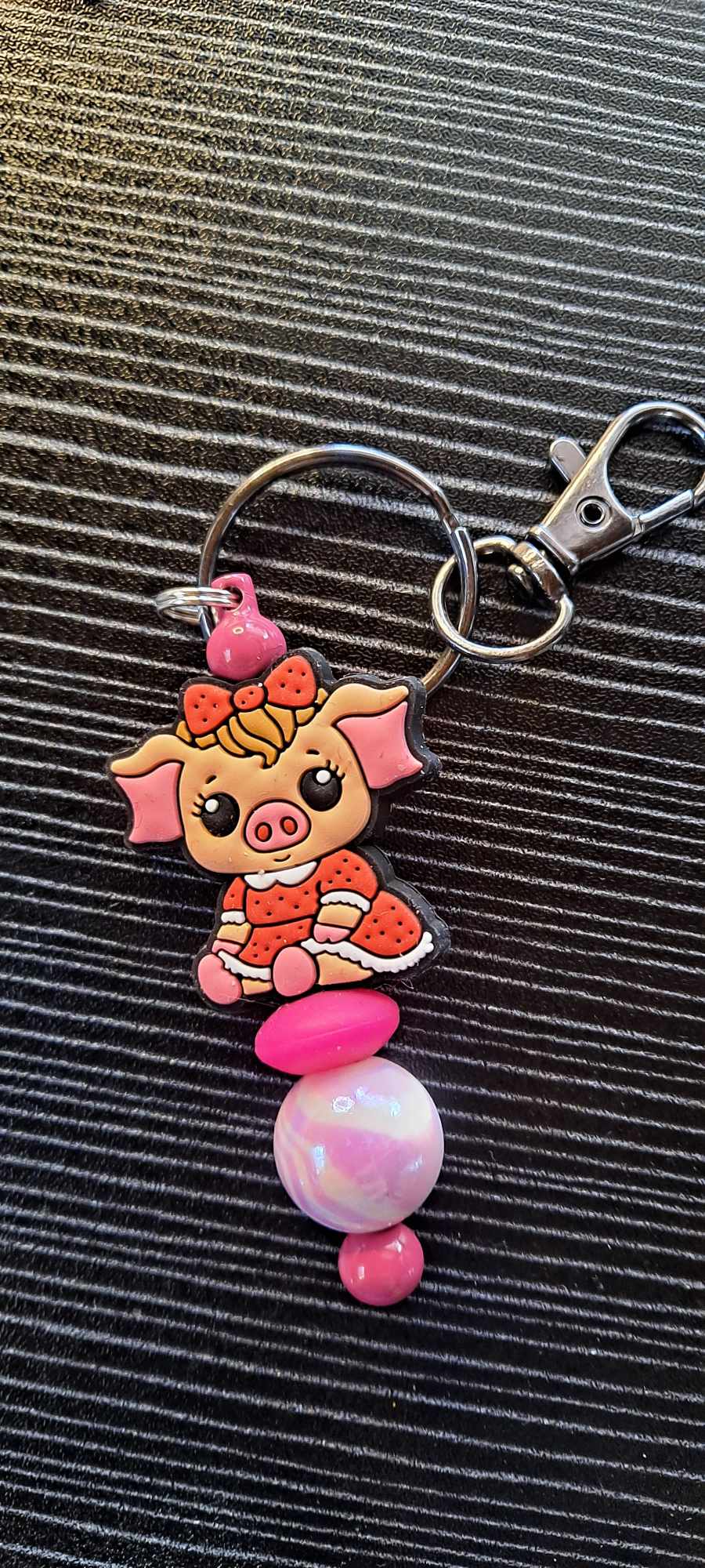 Penelope Pig red dress focal pink swirl bead keychain