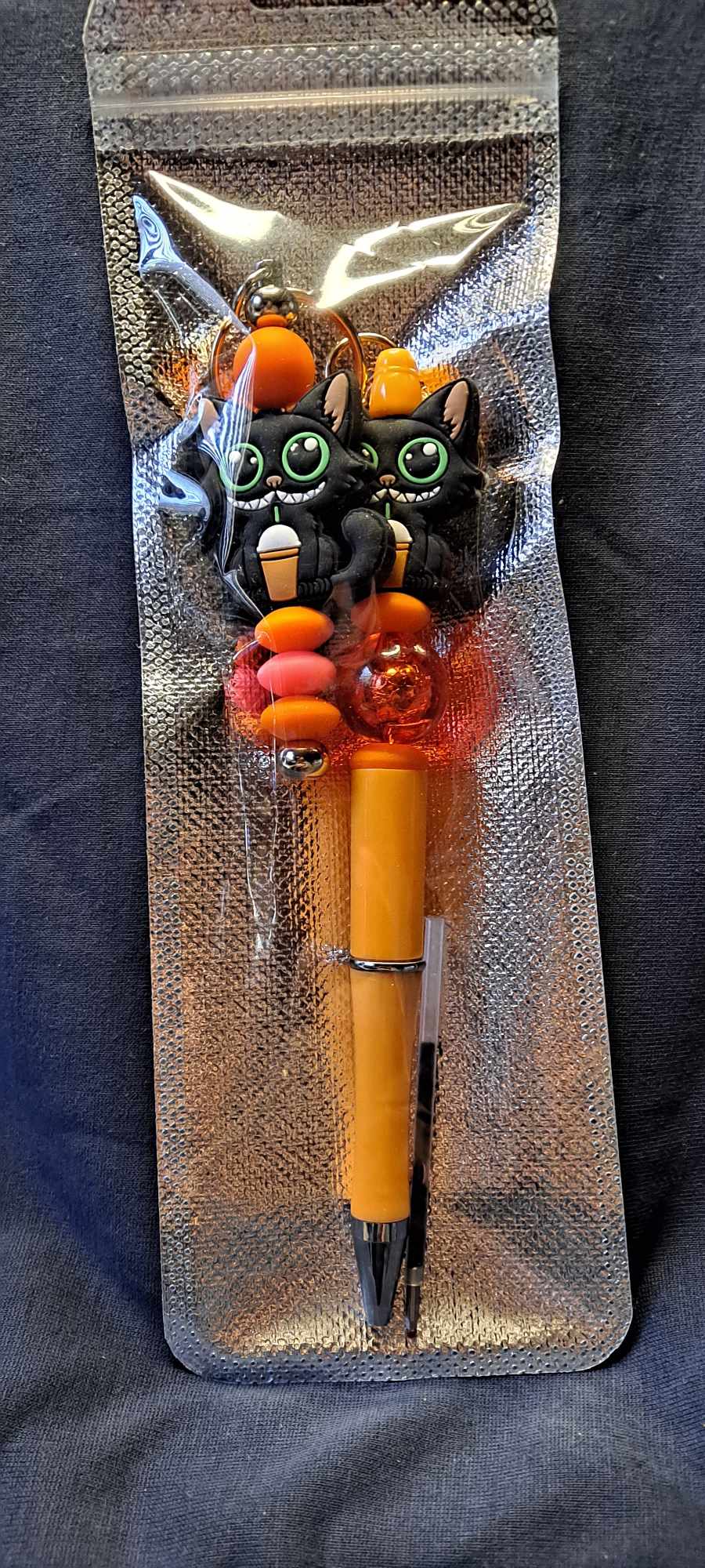 Black cat with frappe focal orange pen keychain set