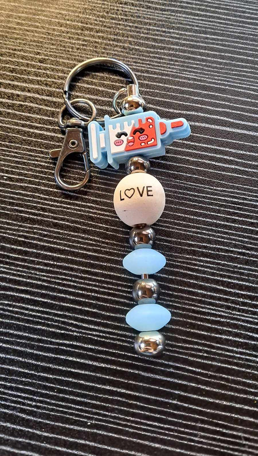 Happy Needle nursing focal love bead keychain