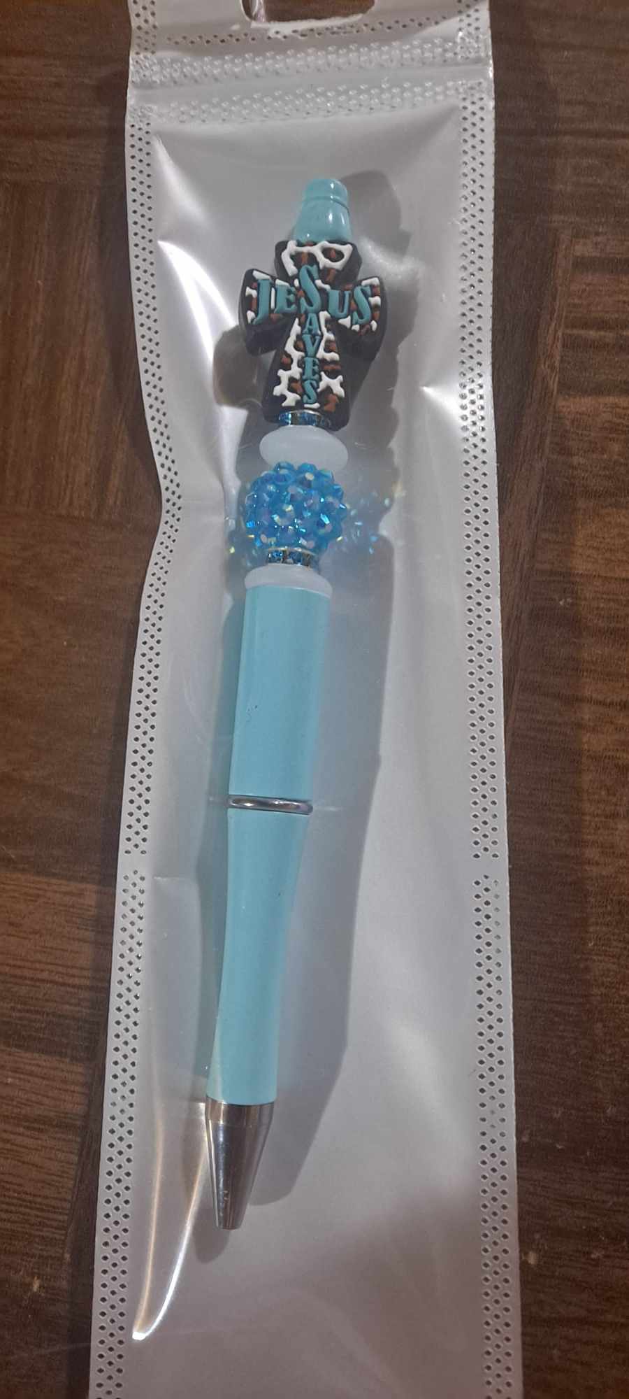 Jesus saves teal cross focal light blue pen