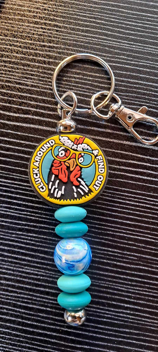 Cluck around and find out focal blue swirl bead keychain